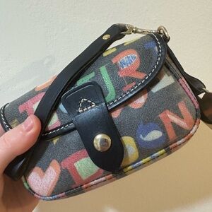 Like new , Y2K Dooney & Bourke Doodle Flap Wristlet Black 6.25"x4.5"